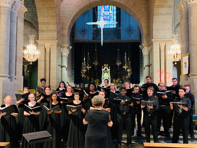 Choral singers performing in an older church 