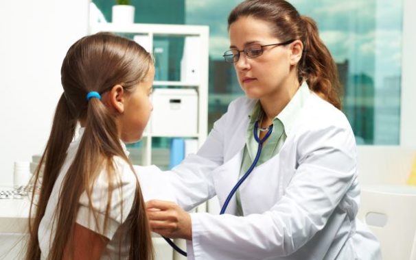 physician examining a girl
