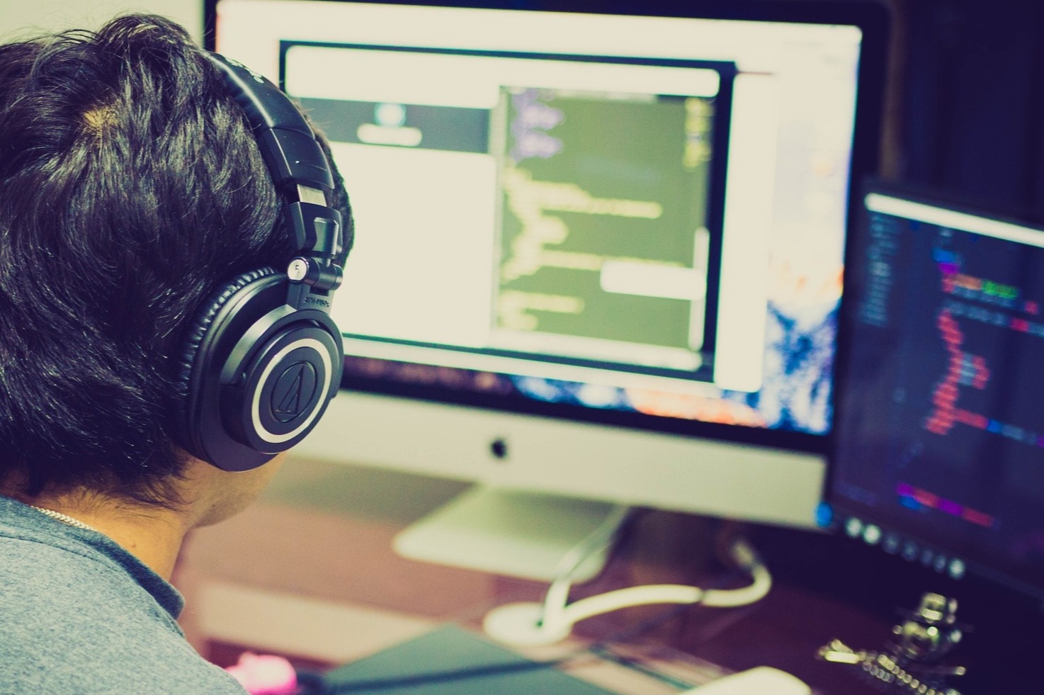 Student programming student at his workstation