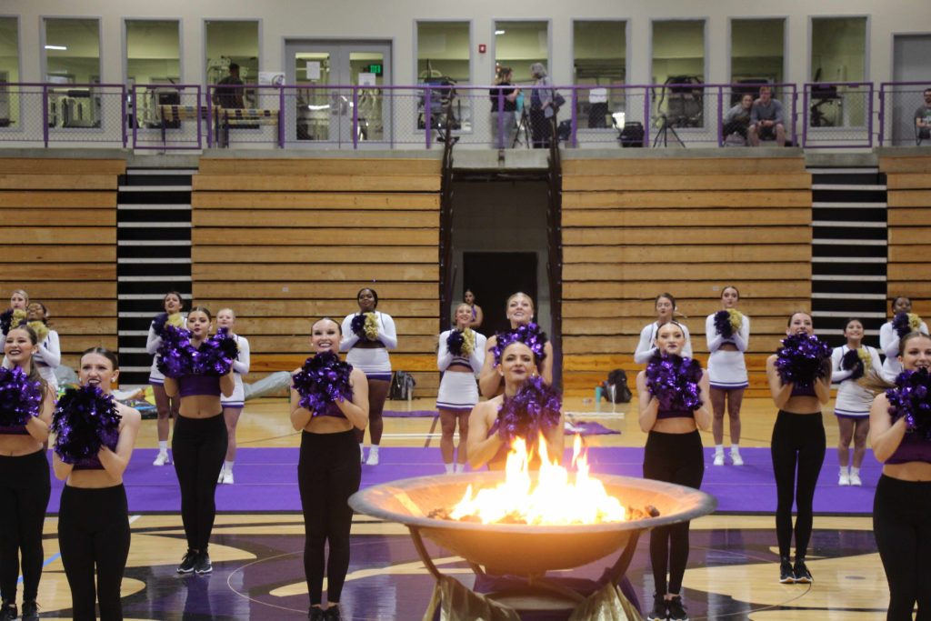 Avila Glitter Girls dance team and cheer squad performing inside Mabee Fieldhouse during Ignite the Flame event