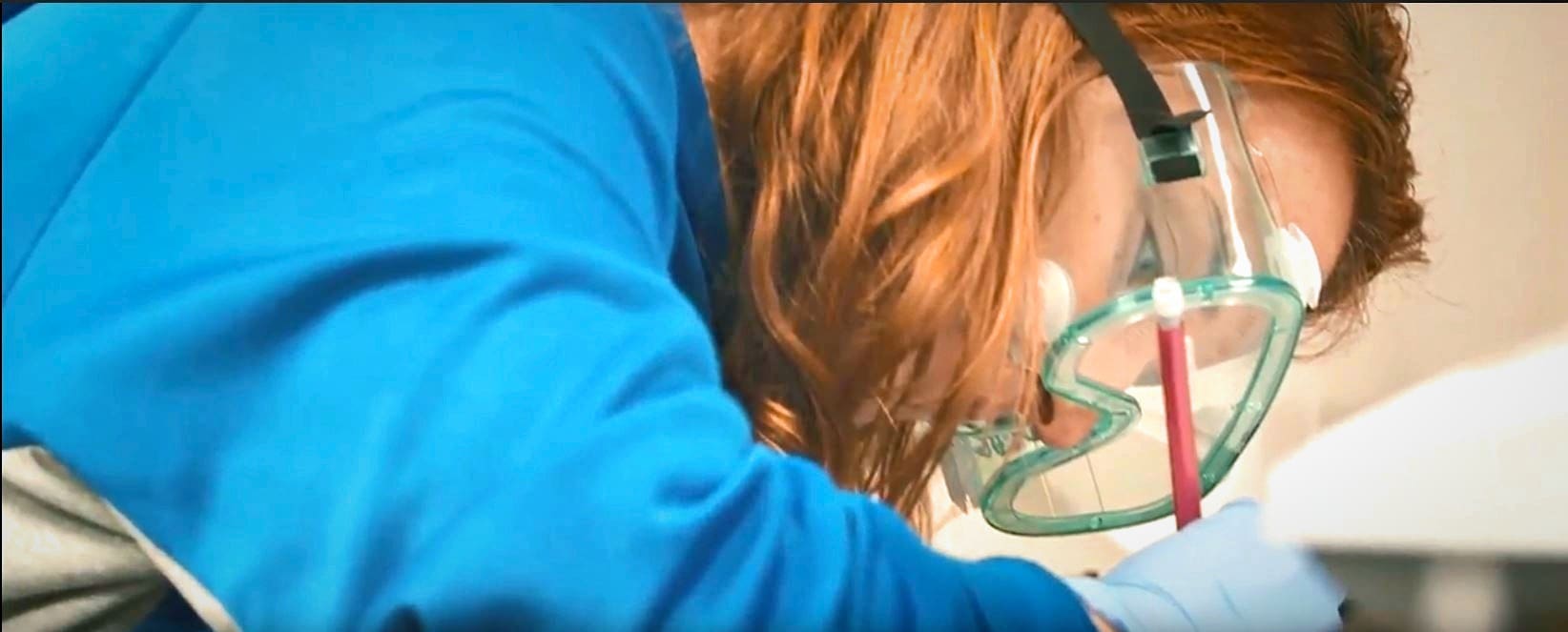 Close up of student wearing goggles in science lab