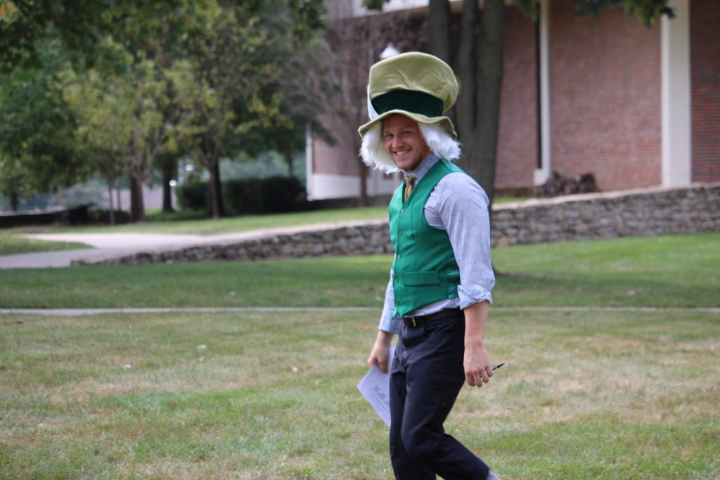 A theatre student walks the campus dressed as the Mad Hatter from Alice in Wonderland