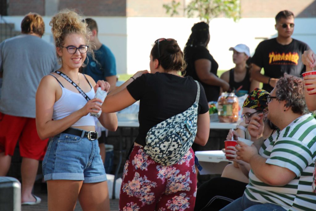 A group of students enjoying ice cream floats during a campus event