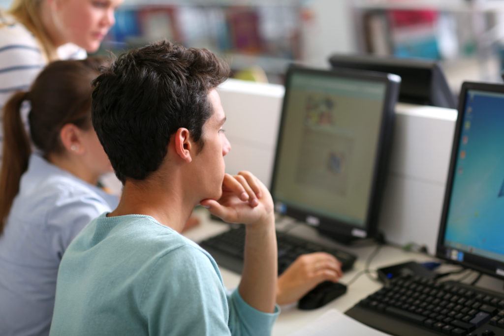 Two students working in a computer lab