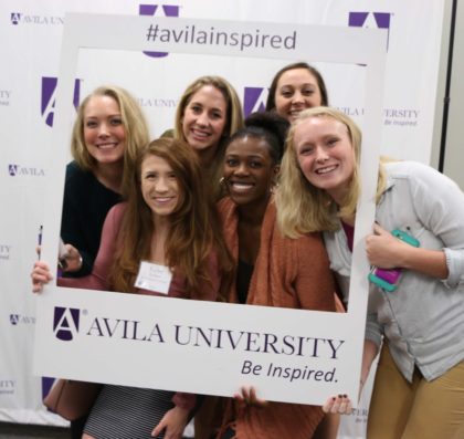 Six student pose in an oversized Polaroid frame. #AvilaInspired and Be Inspired are on the frame