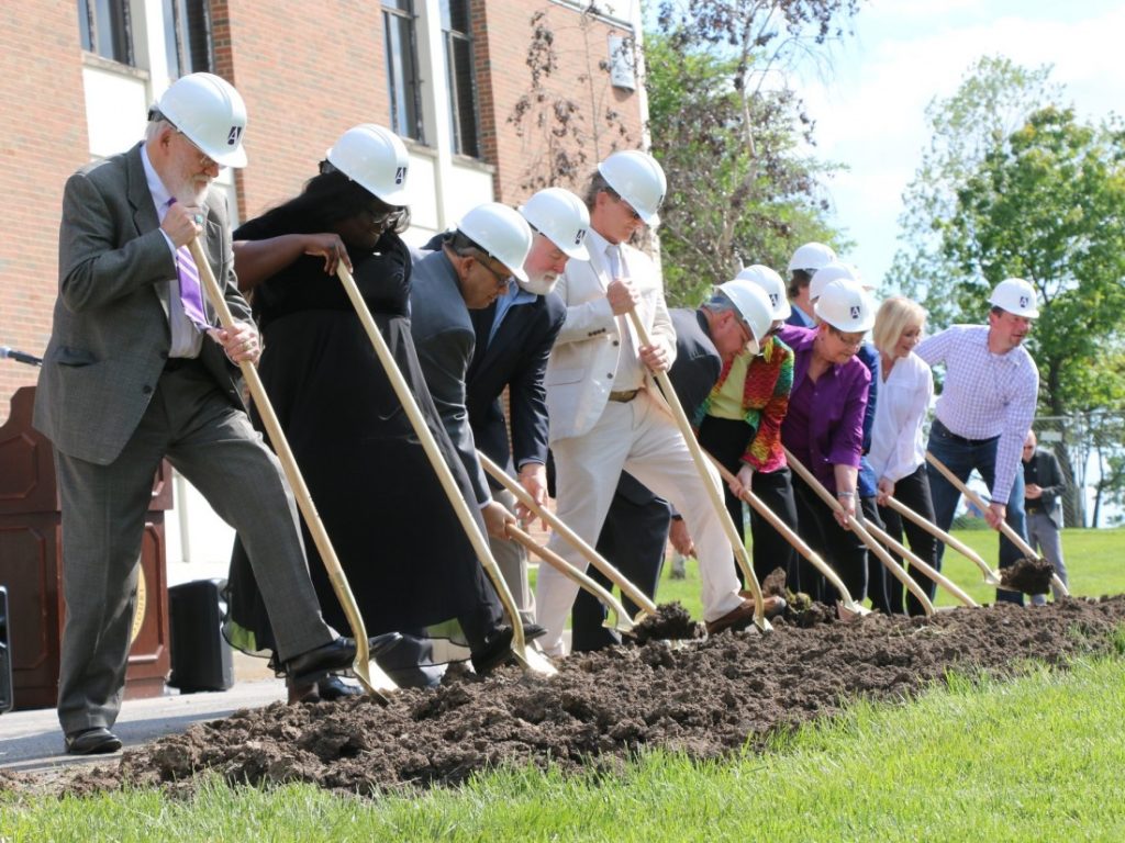 University Staff Break Ground in Front of Goppert Theatre