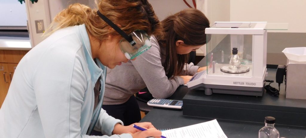 two students in the biochemistry lab