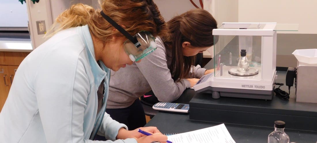 two students in the biochemistry lab