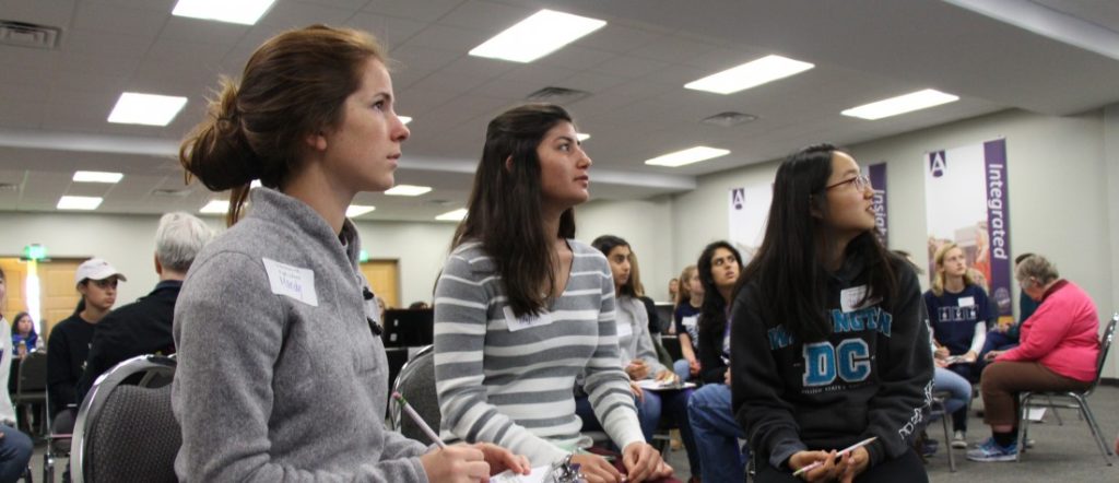 Three students at science and math competition