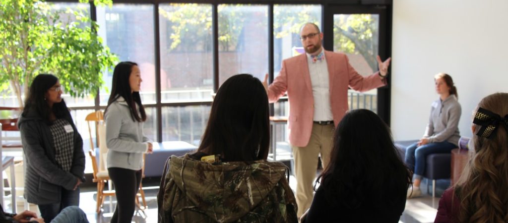 Professor Joe Roberts speaking to a group of students