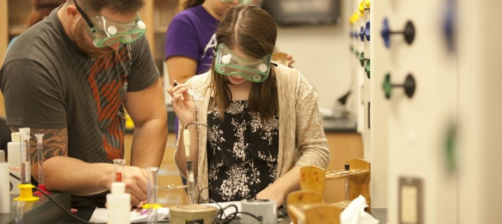 Two students in the Microbiology lab