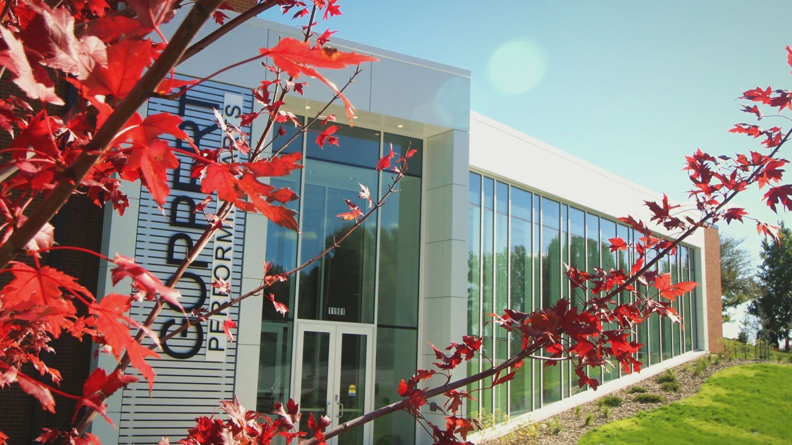 The exterior of the Goppert Performing Arts Center in the fall