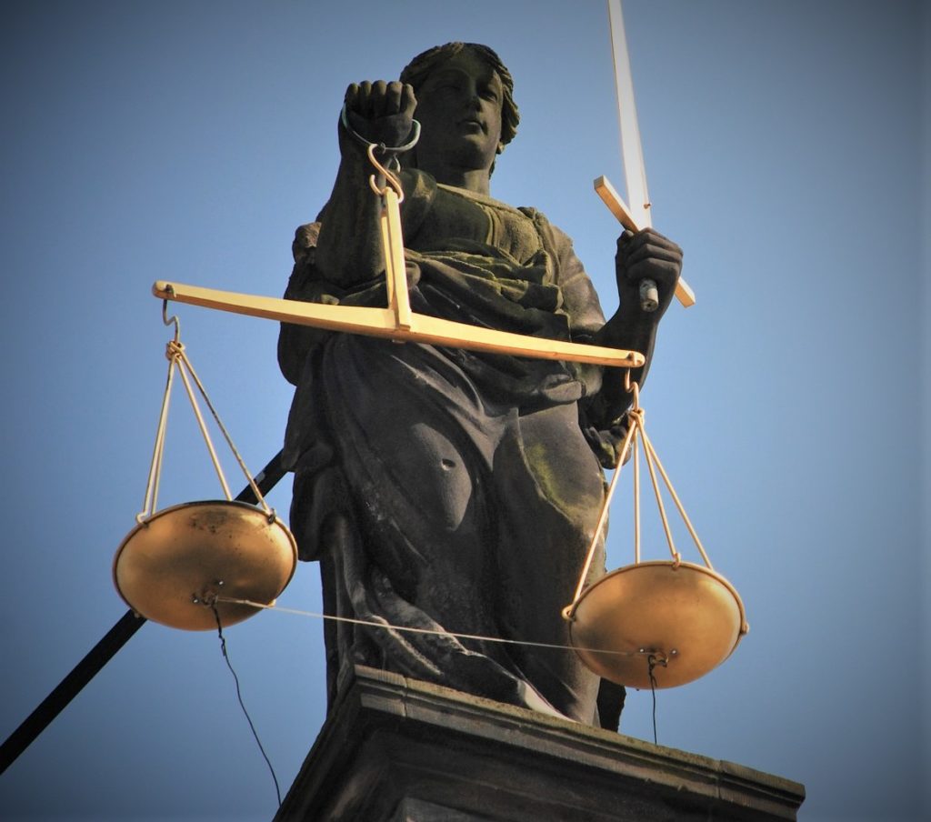 Statue of lady justice is representative of criminology and justice studies.