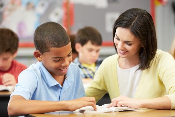Reading specialist teacher with student
