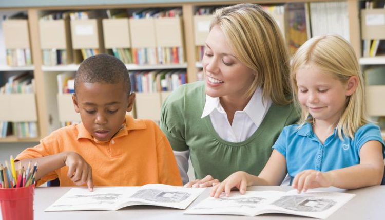 Reading specialist teacher with student
