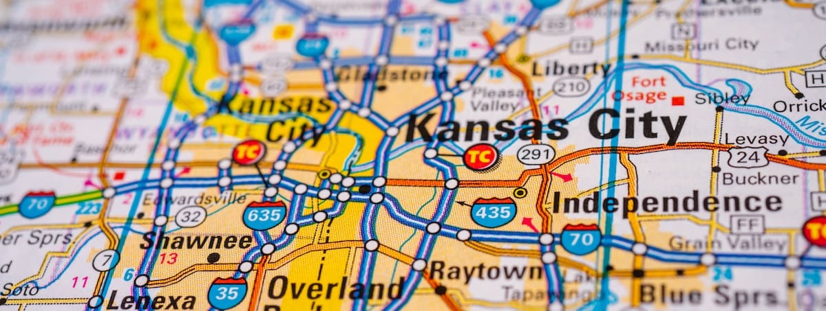 Close up of paper road map showing major highways around the Kansas City metro