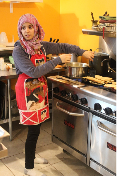 woman at a restaurant style stove