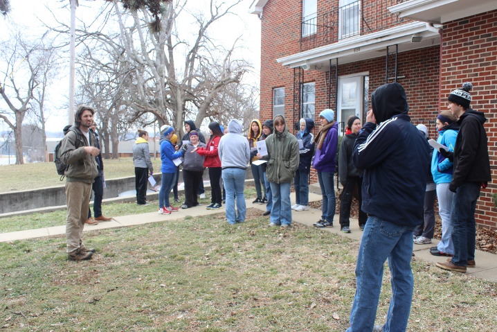 Group of people milling about outside Jerusalem Farm