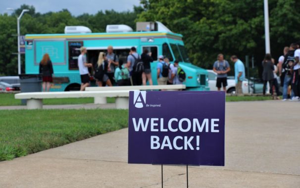 Welcome back students sign in front of Betty Rae's ice cream truck