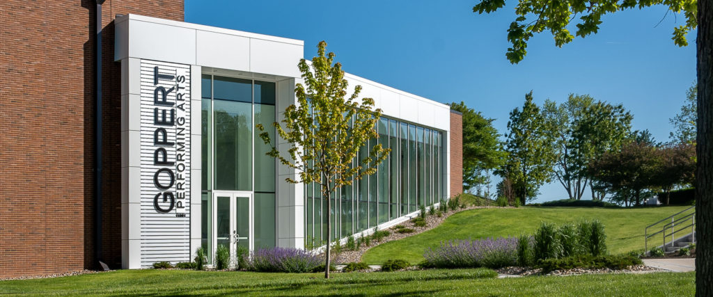 Exterior photo of Goppert Performing Arts Center during daytime.