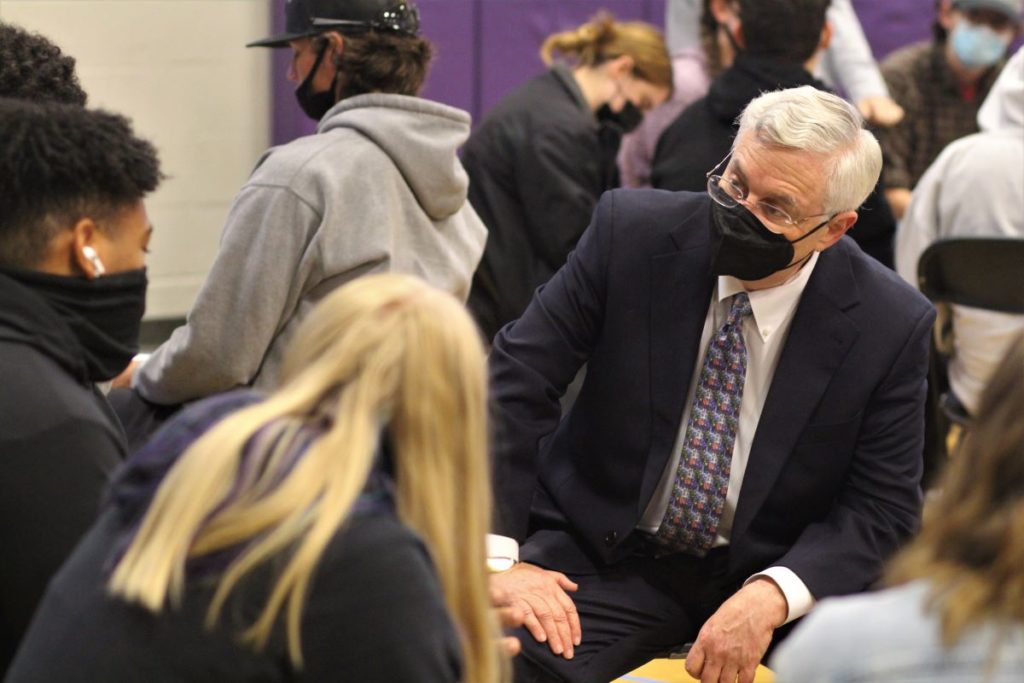 Judge Richard Gergel interacting with a small group of students