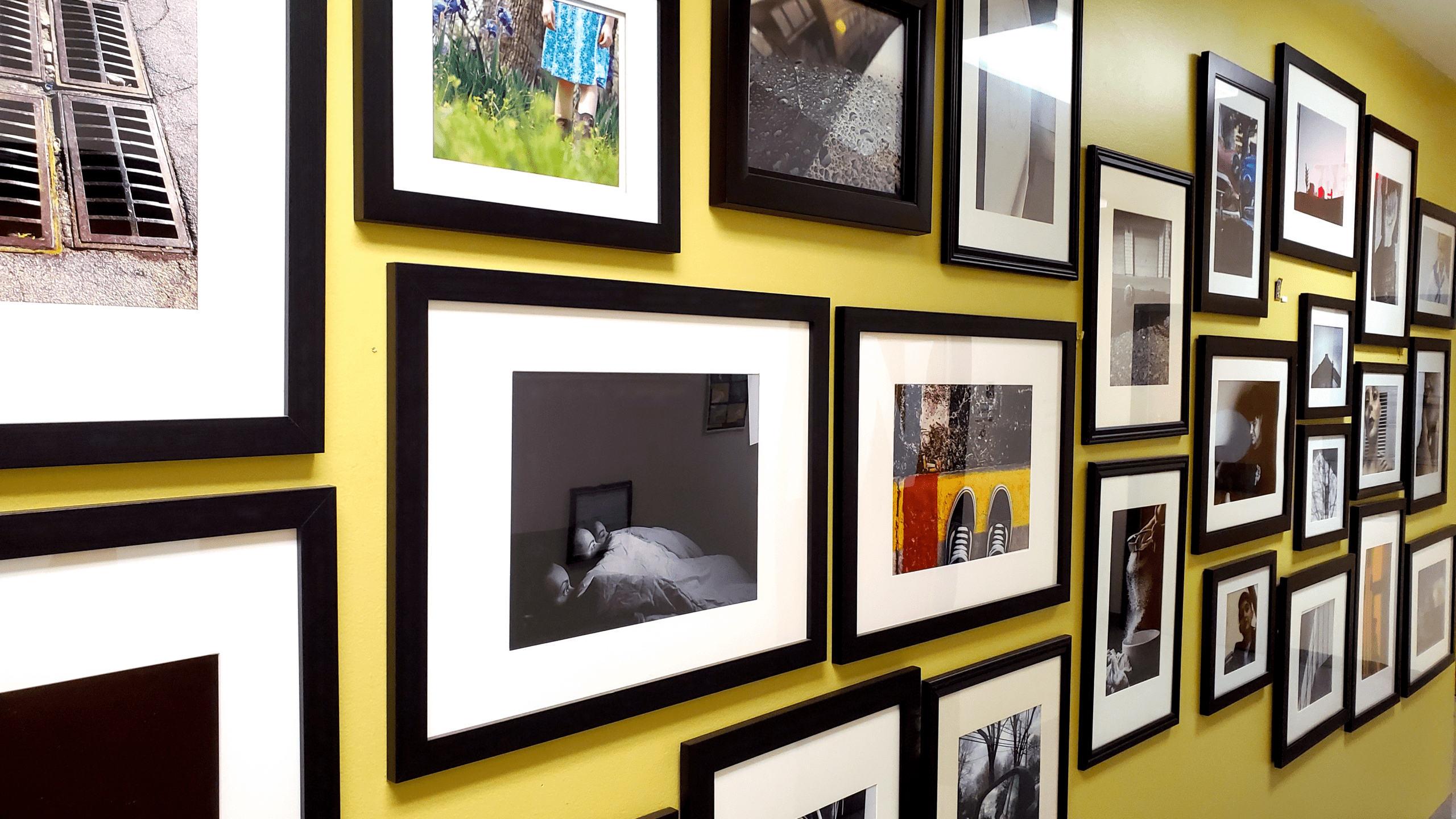 wall of photos from VISCOM program.