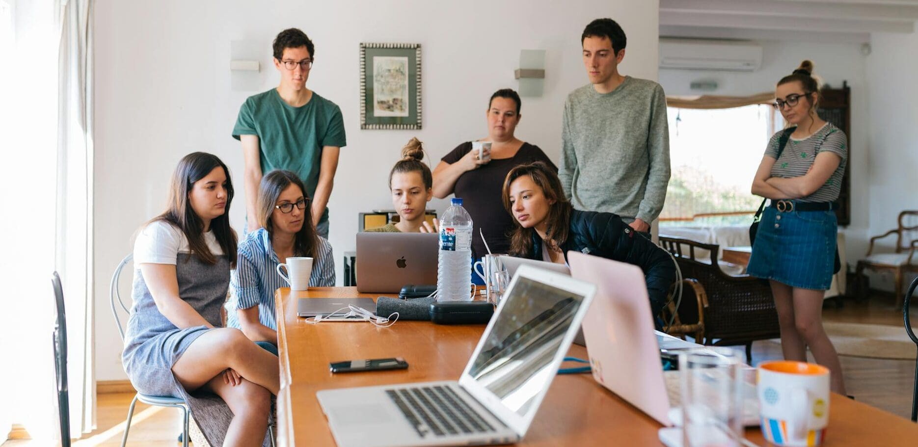 group of people watching on laptop
