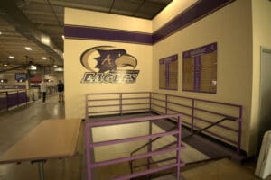 Athletic facility hallway or training area with equipment