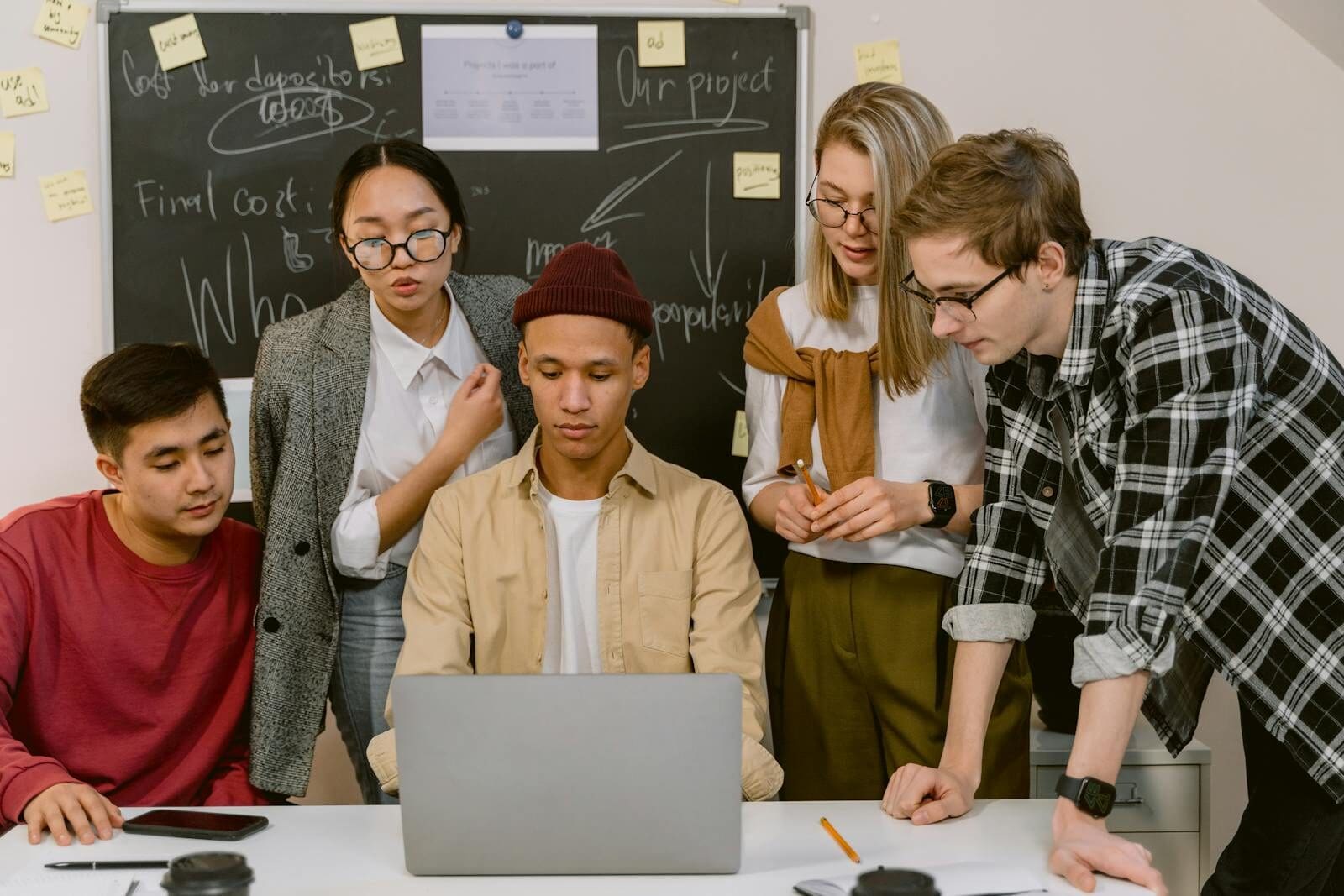 A diverse team engages in a collaborative brainstorming session in a modern office setting.
